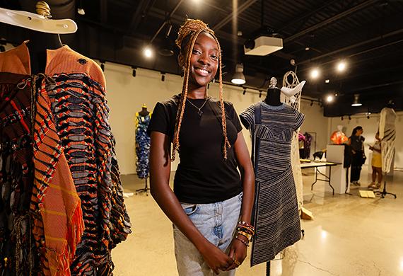 Kunda Nampasa ’25 preparing for the exhibit at Steel Plant. Photo by Nelson Echeverria/Marist College.