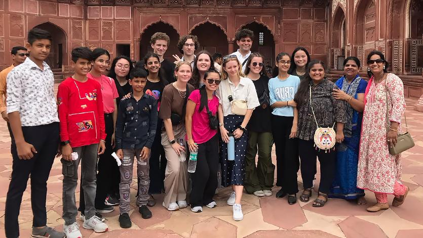 Image of ASAP ’23 students interact with other visitors at the Taj Mahal. 