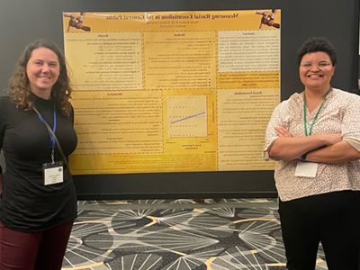 Image of student and 教师 member presenting research at the Eastern Psychological Association.